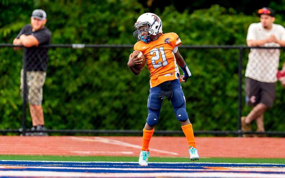 CFA Youth Football League team youth athlete touchdown celebration in Hershey PA, SportsFox Photography.