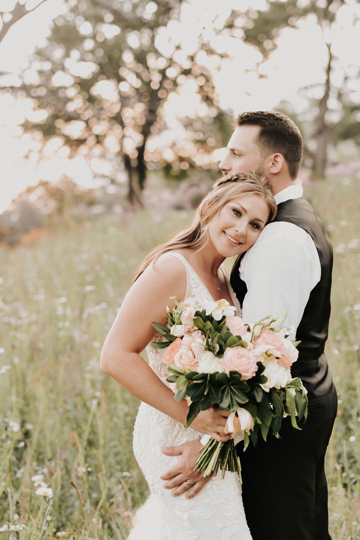 Spring wedding couple portraits captured in warm golden hour light at Towering Oaks.