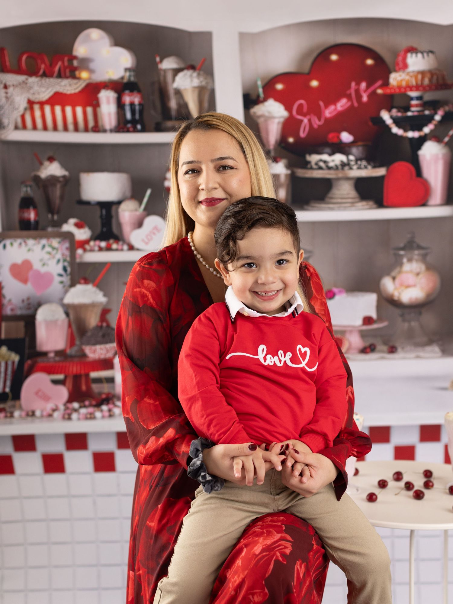 A festive Valentine's Day themed kitchen setting with red and white decor, checkered tiles, and heart decorations.