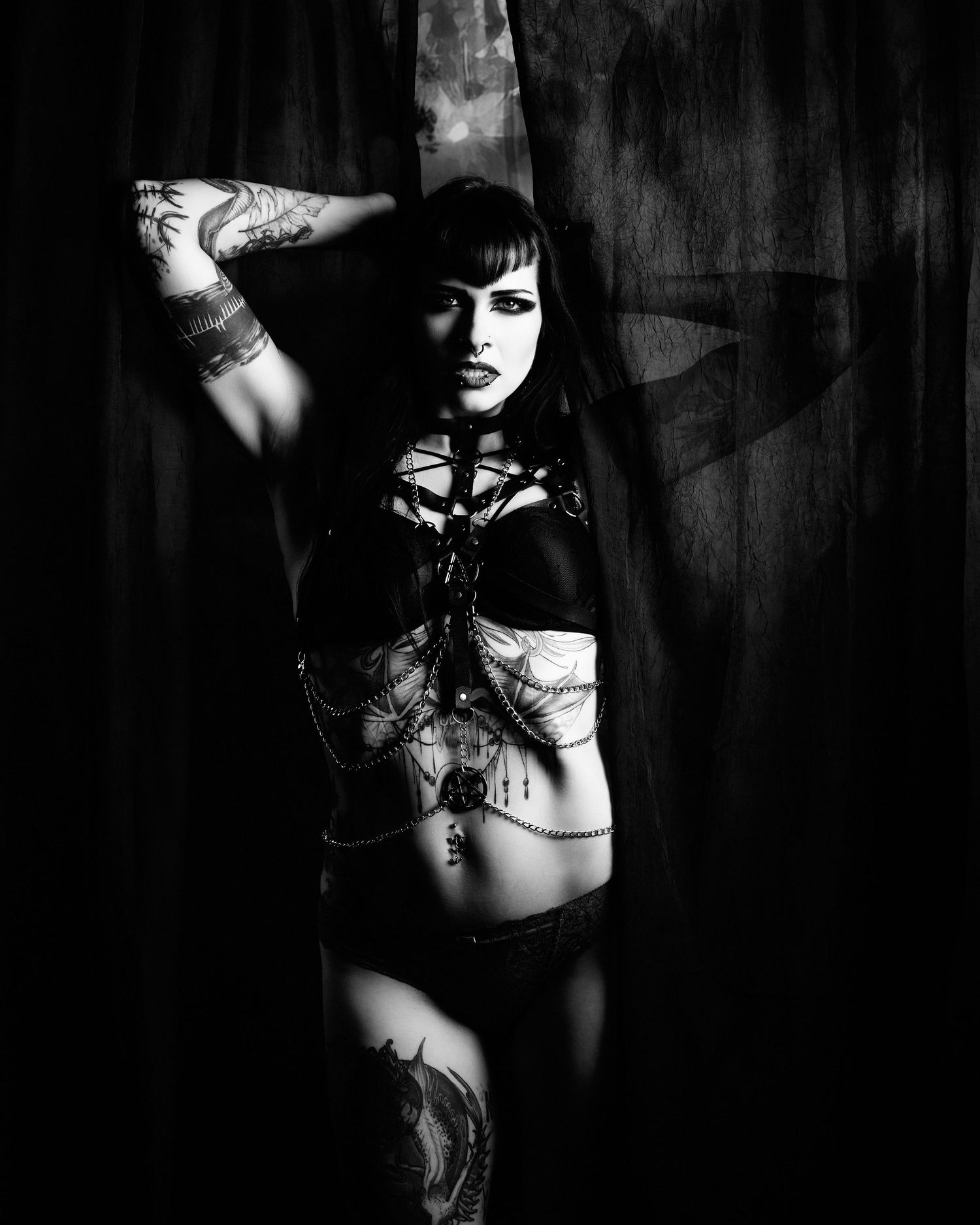 David G Holt Photography - Dark and moody boudoir portraits with dramatic shadows and tattoo details.