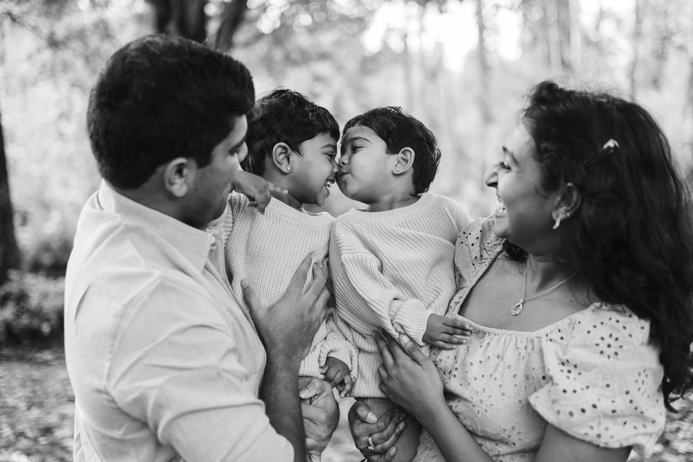 A series of black and white photos showing romantic couples embracing and kissing in outdoor settings.