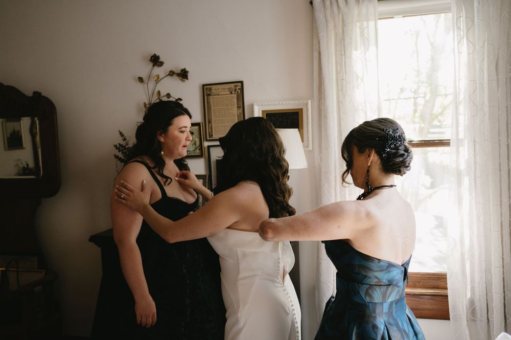 A heartwarming moment of preparation before the wedding ceremony.
