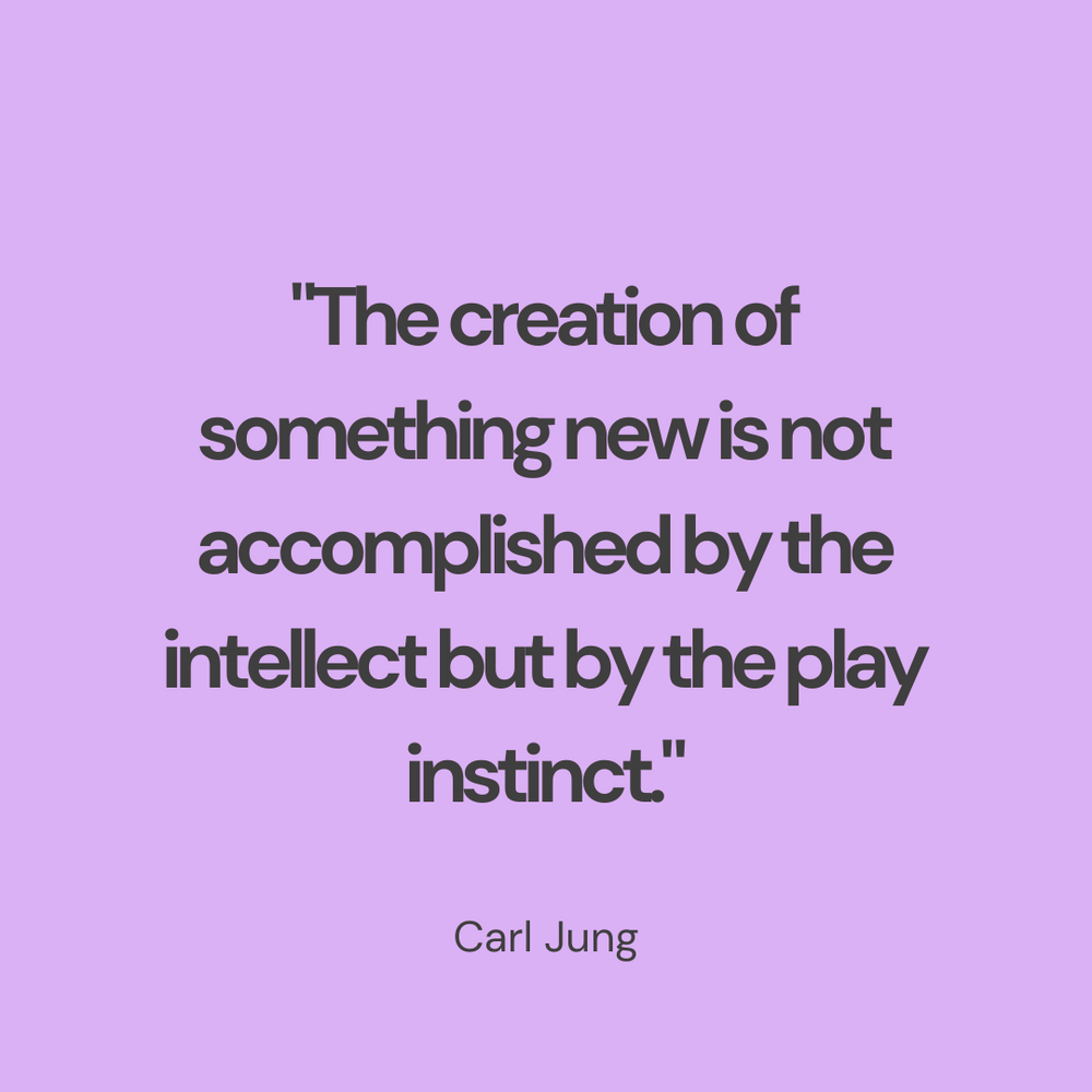 A Carl Jung quote about creation and play instinct displayed on a purple background.