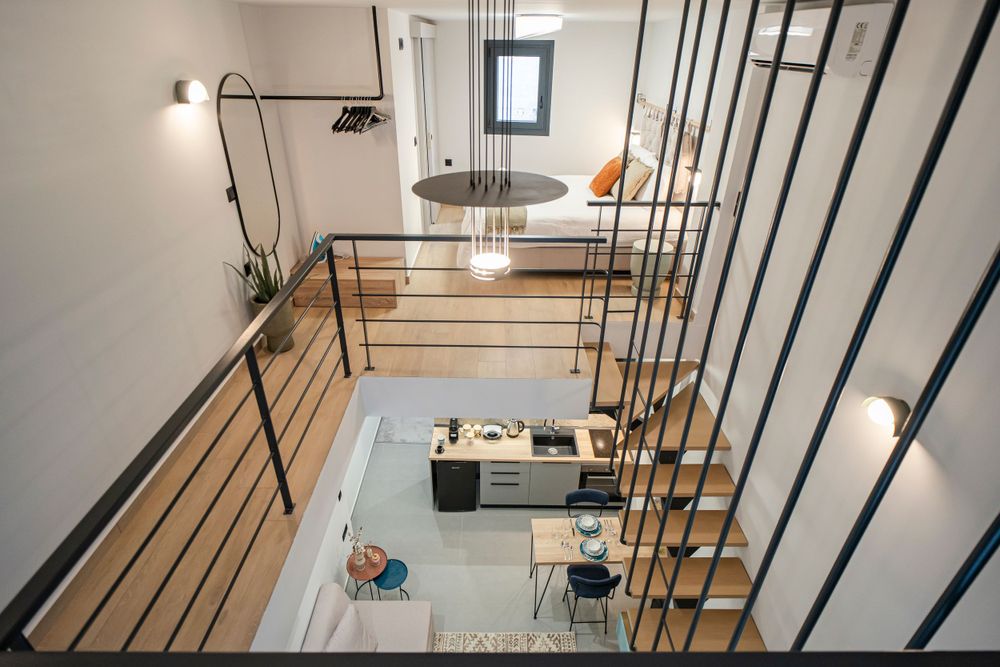 Modern loft apartment interior with metal railings and open concept design viewed from above.
Τρίκαλα Θεσσαλίας. Trikala.