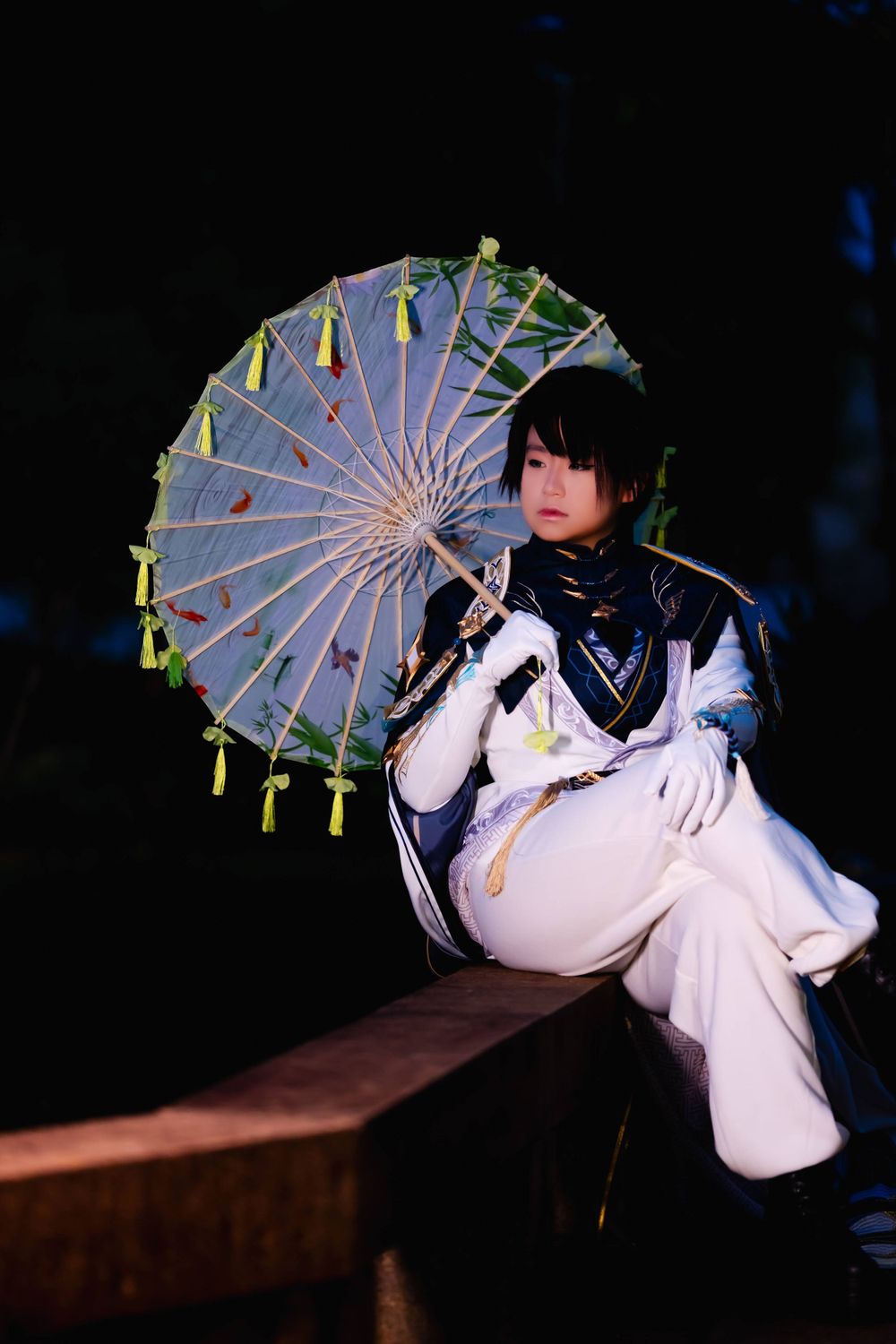 Cosplay figure in white outfit sits with decorative parasol against dark background.