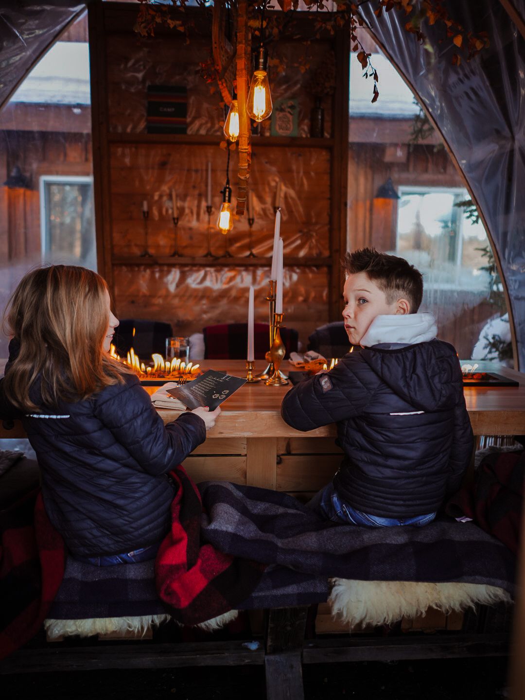 Cozy winter lounge area with warm lighting and comfortable seating.