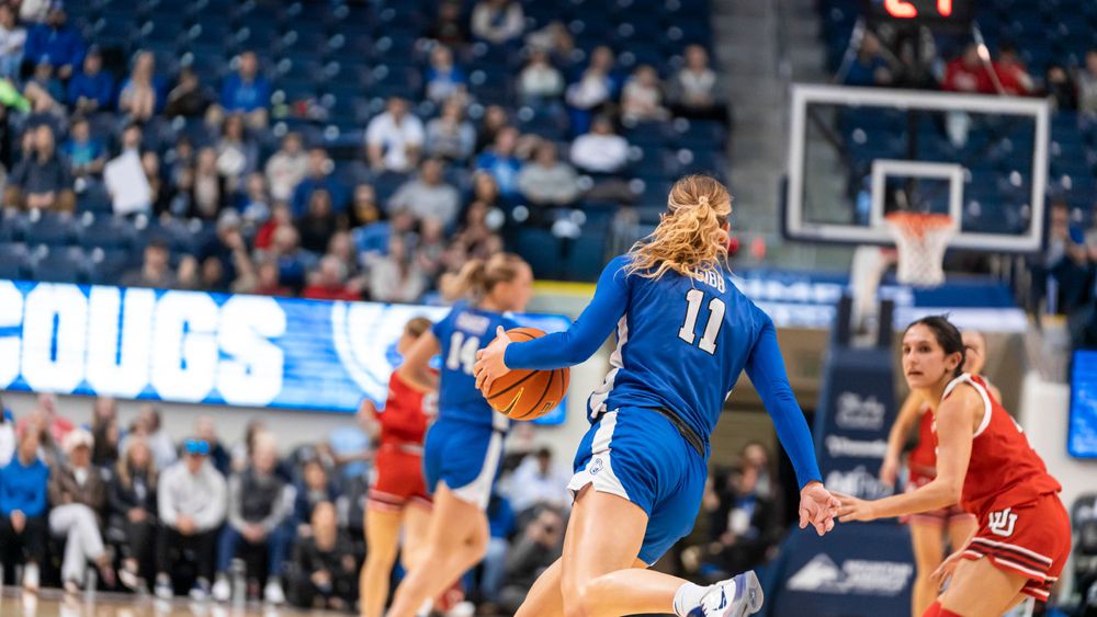 BYU Womens basketball player running towards the hoop