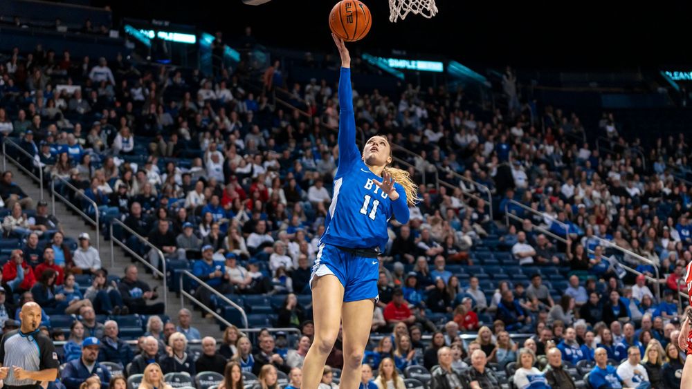BYU Womens basketball player mid air for a layup
