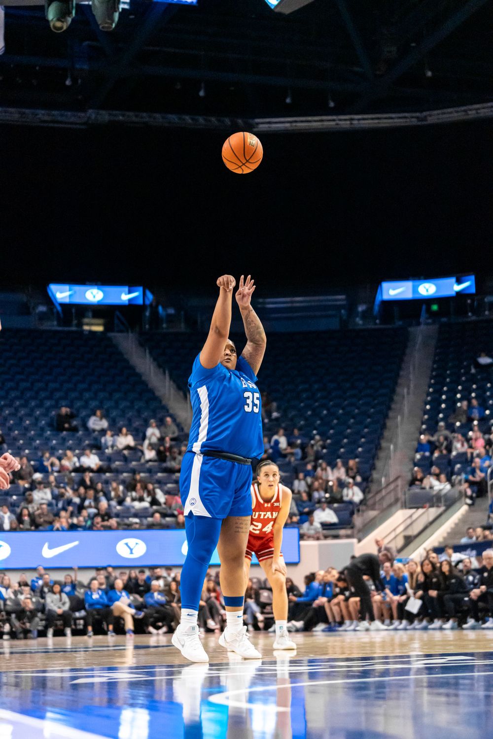 BYU Womens basketball player throwing a three pointer