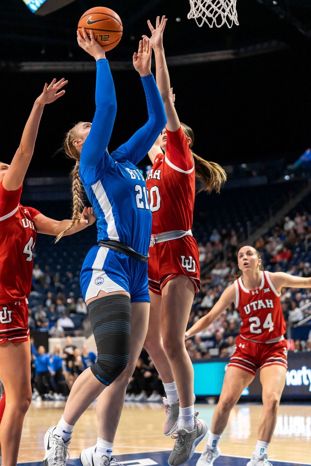 BYU Womens basketball player jumping for a layup