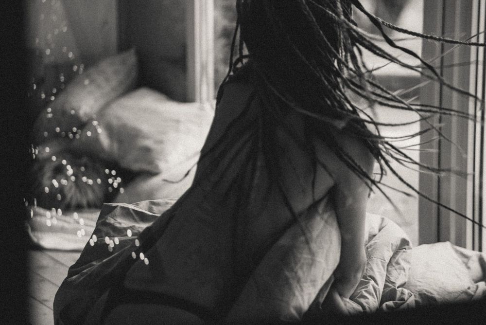 Moody black and white portrait sequence with water droplets and dramatic lighting.
