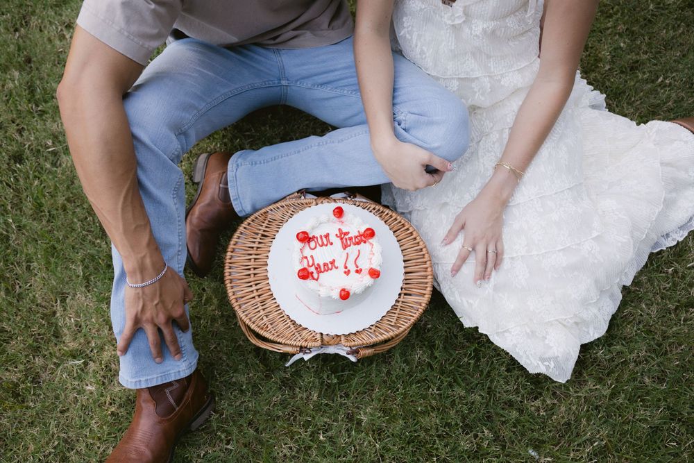 A series of photos showing hands holding paper plates with red writing and messages on them against grass and white fabric.