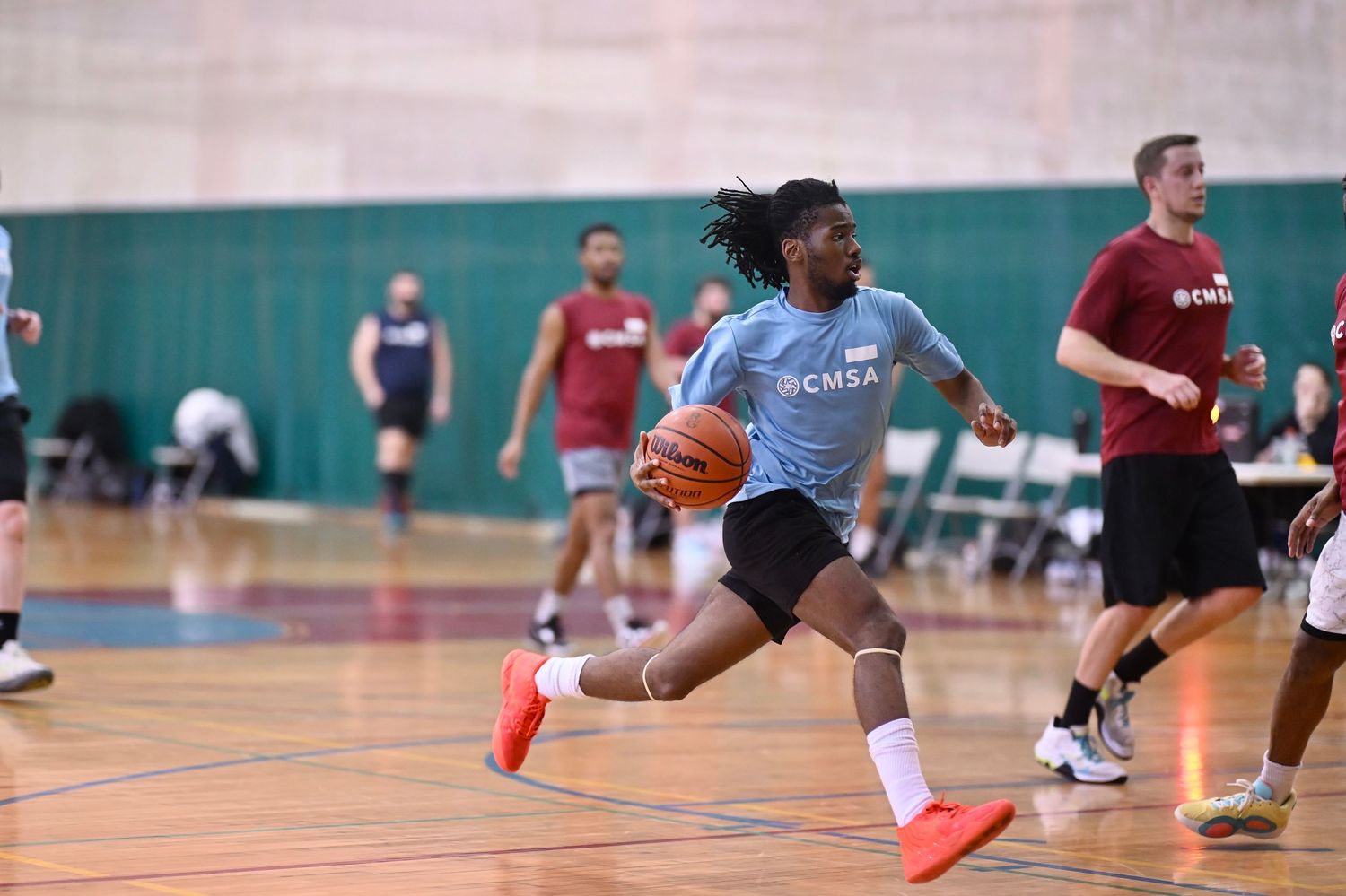 A player attempts to complete a breakaway in a game of basketball at Broadway Armory in Chicago