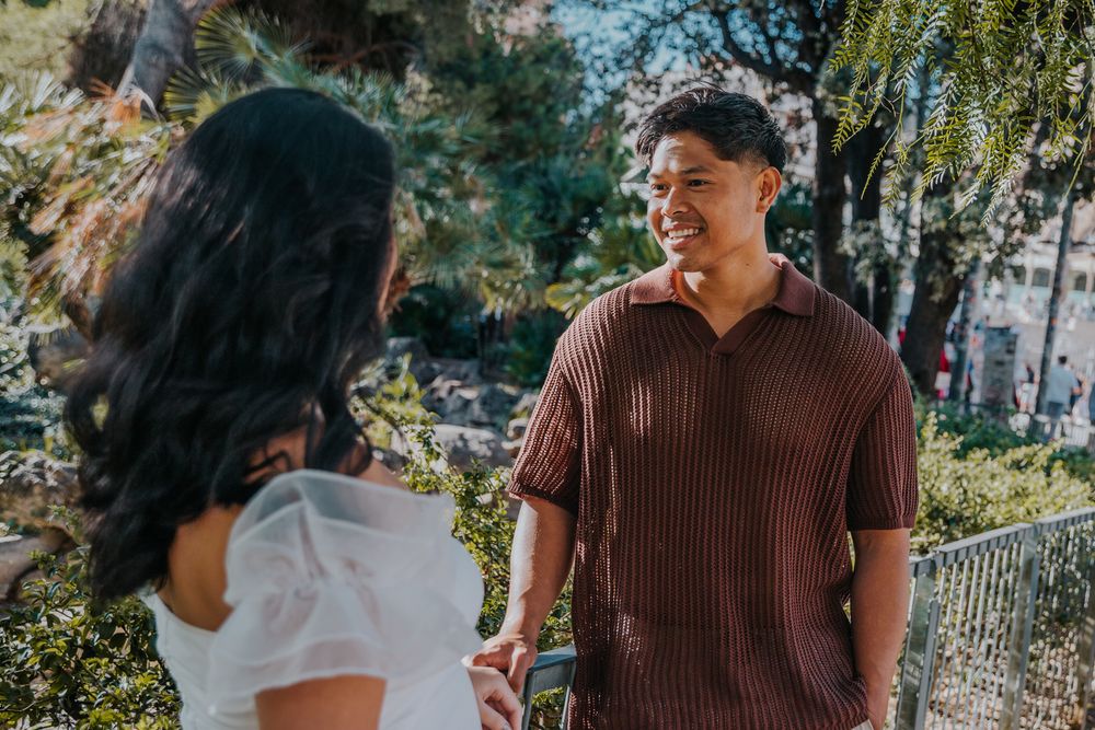 Expecting parents glowing in golden light