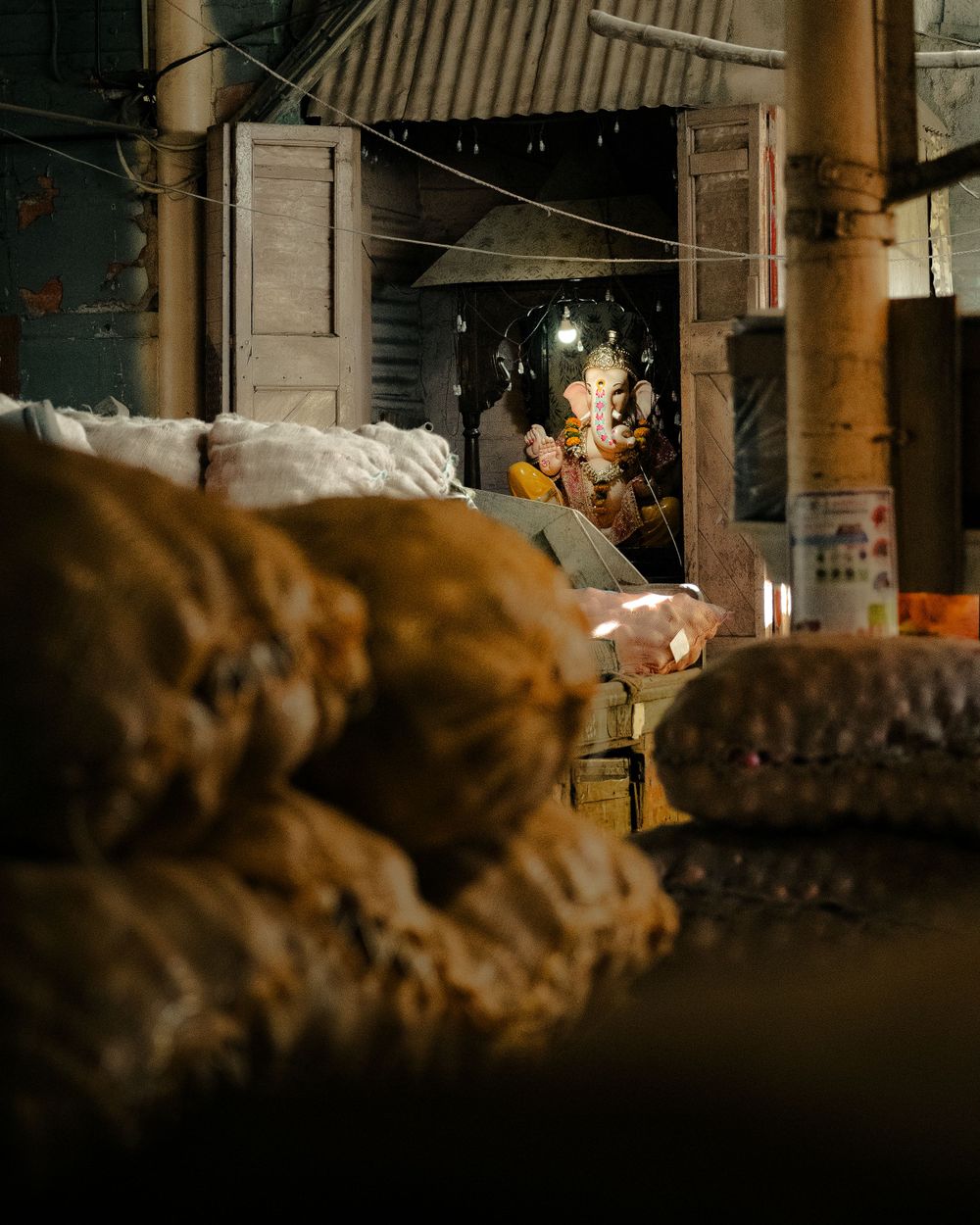 Dimly lit underground space with rough stone walls and scattered debris.