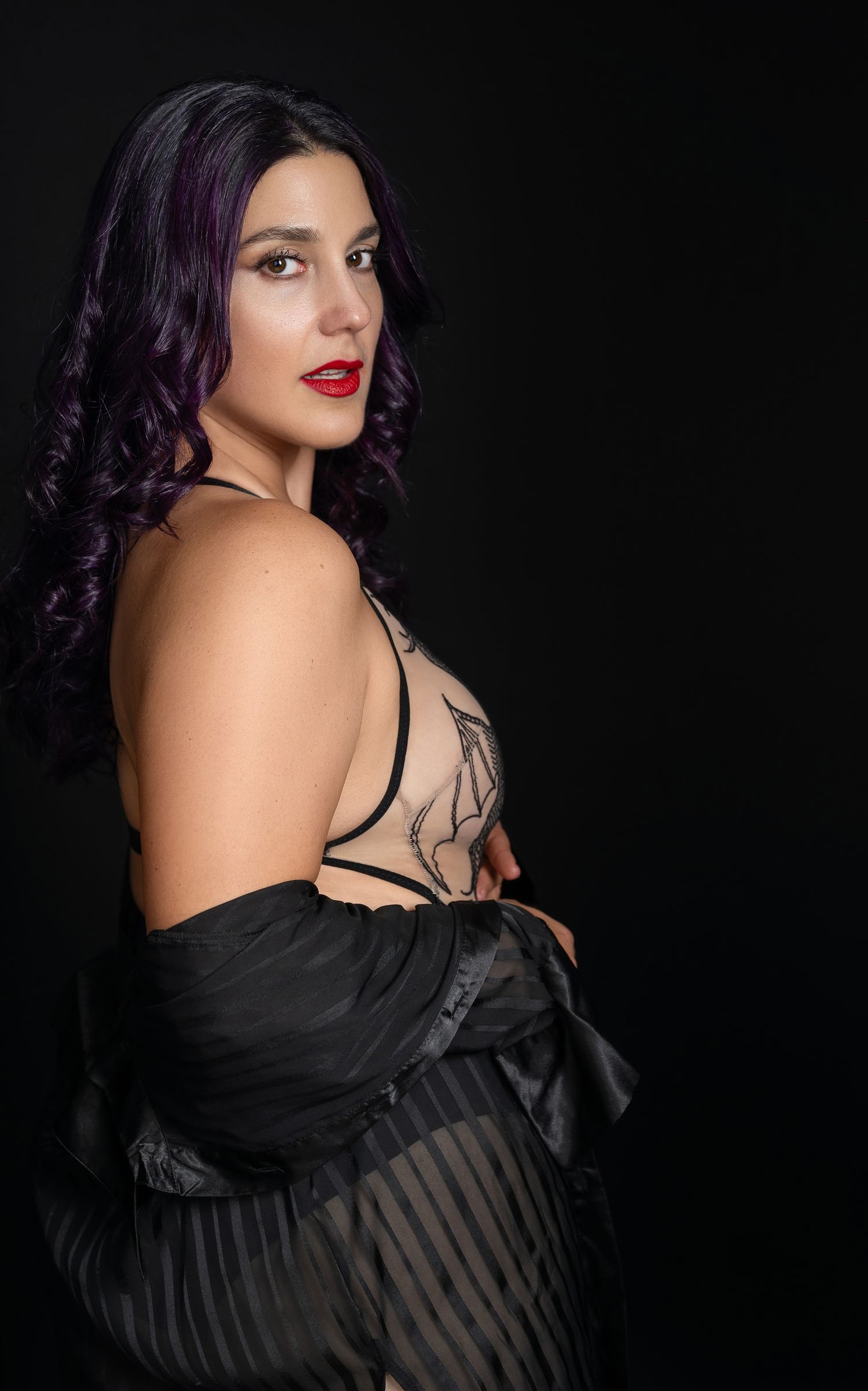 Boudoir photography by Soulful Portraits by Mayeluz in Charlotte, NC, celebrating confidence, beauty, and self-love with empowering photos.