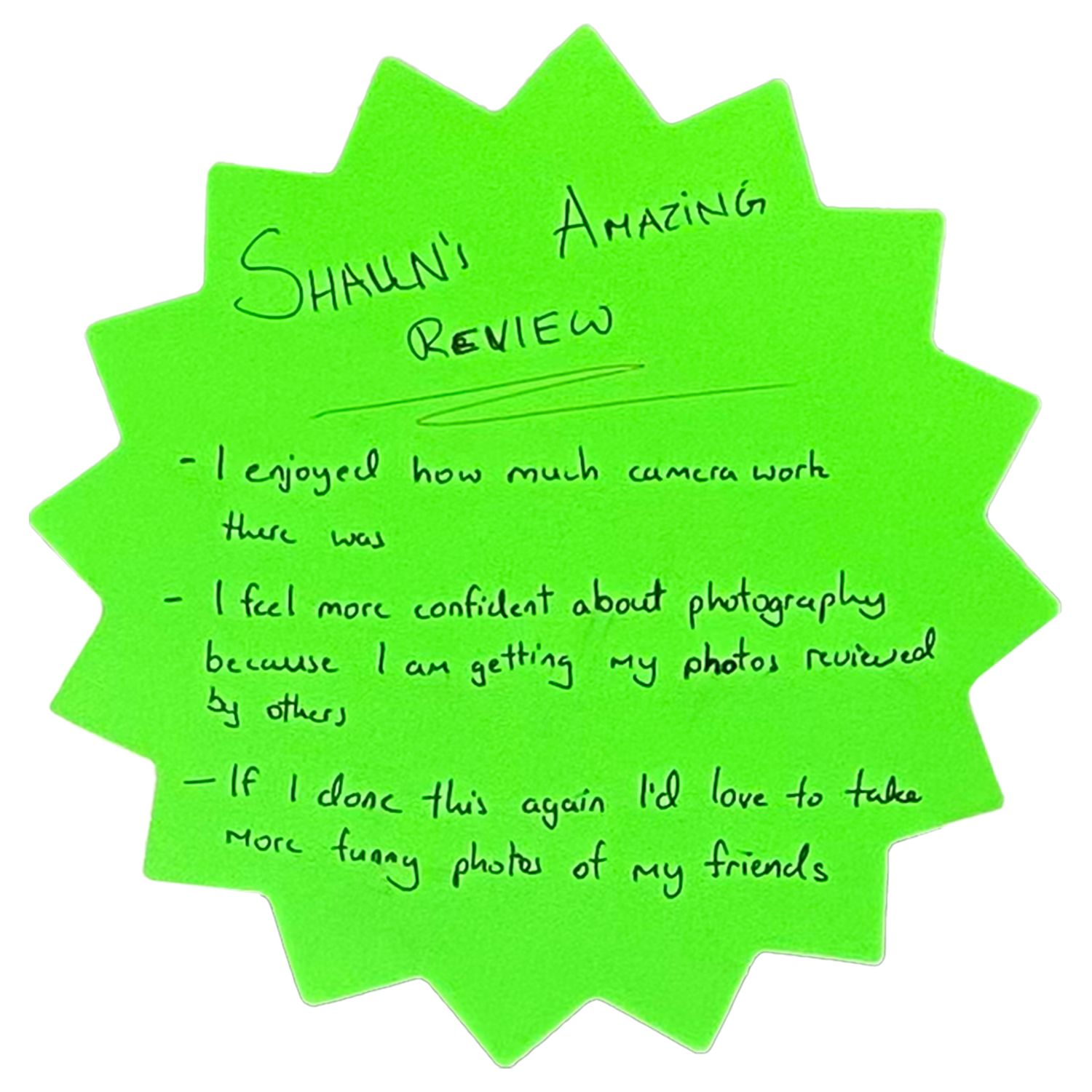 Green star-shaped note with handwritten student review feedback.