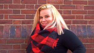 Red brick wall background with rustic weathered texture.