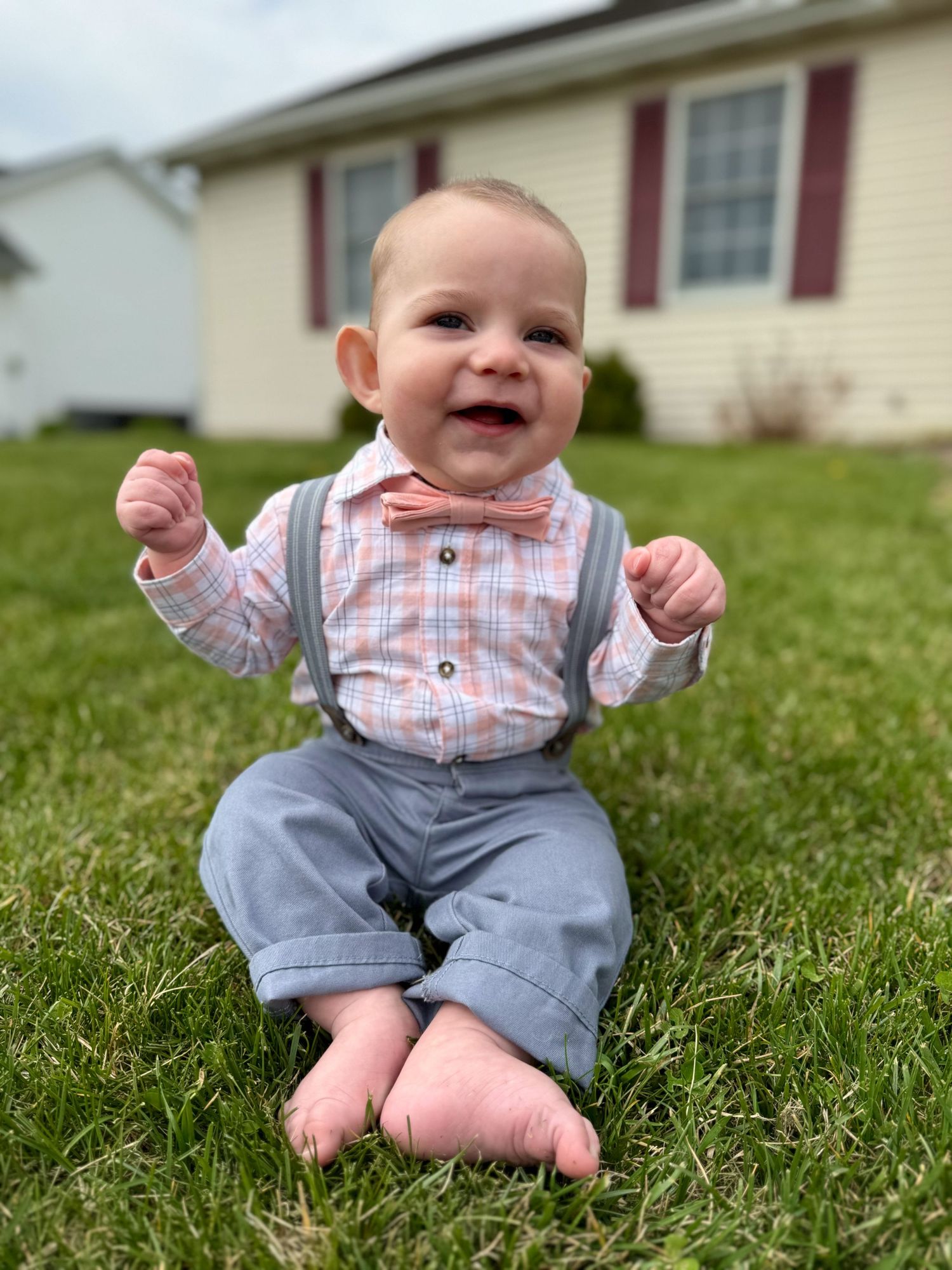 Springfield, IL family photographer shares insight to her life with a picture of her son sitting in the grass on his first Easter.