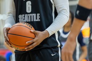 Seattle basketball player number 6 holding an orange basketball during a game or practice session.
