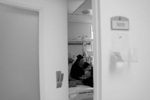 A series of black and white images showing empty hospital corridors, waiting areas, and patient rooms.