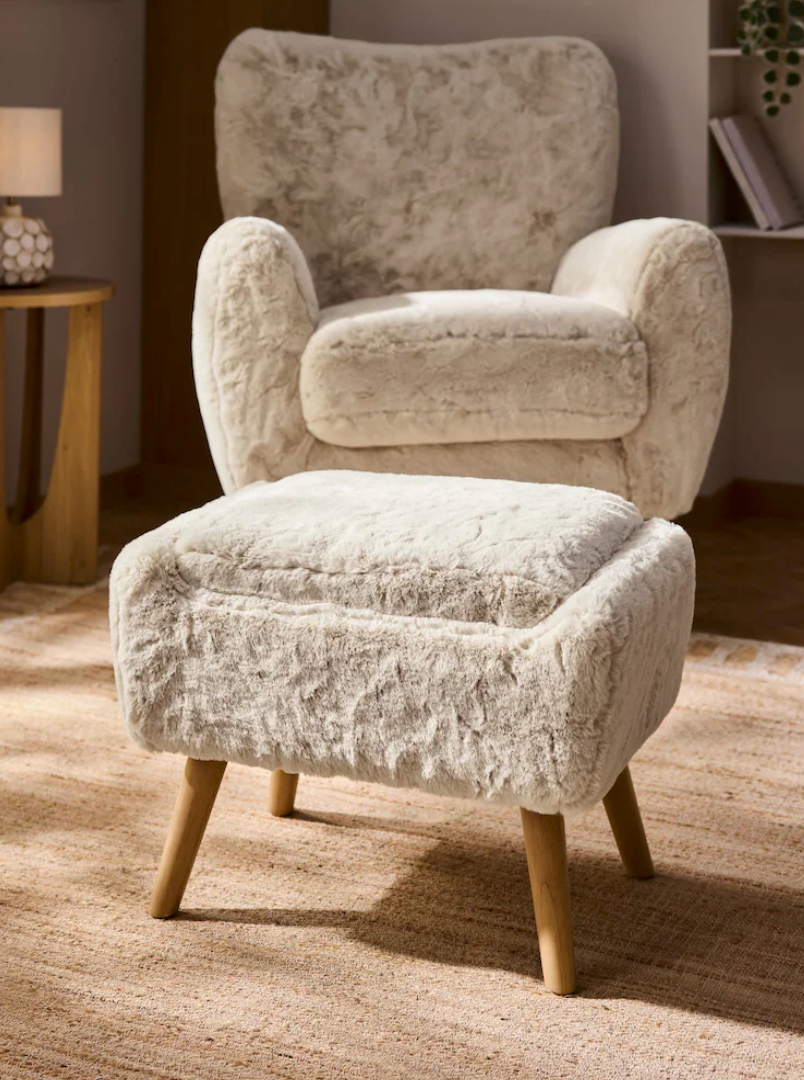 A modern velvet upholstered accent chair with wooden legs shown from multiple angles on a beige carpet.