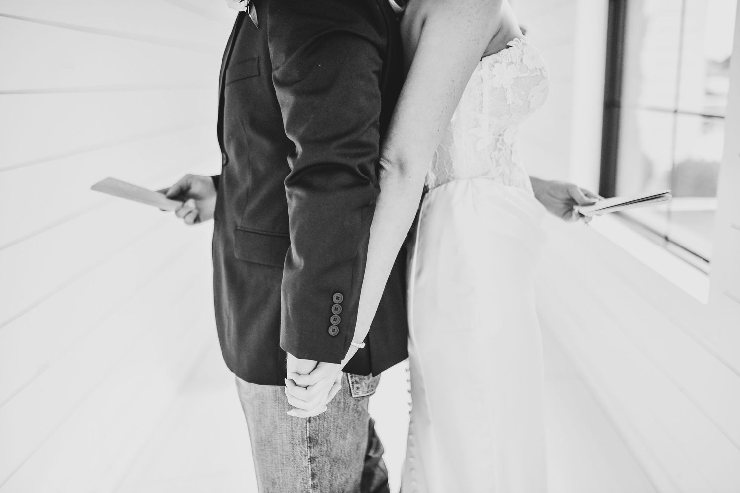 Bride and groom sharing private vows before ceremony