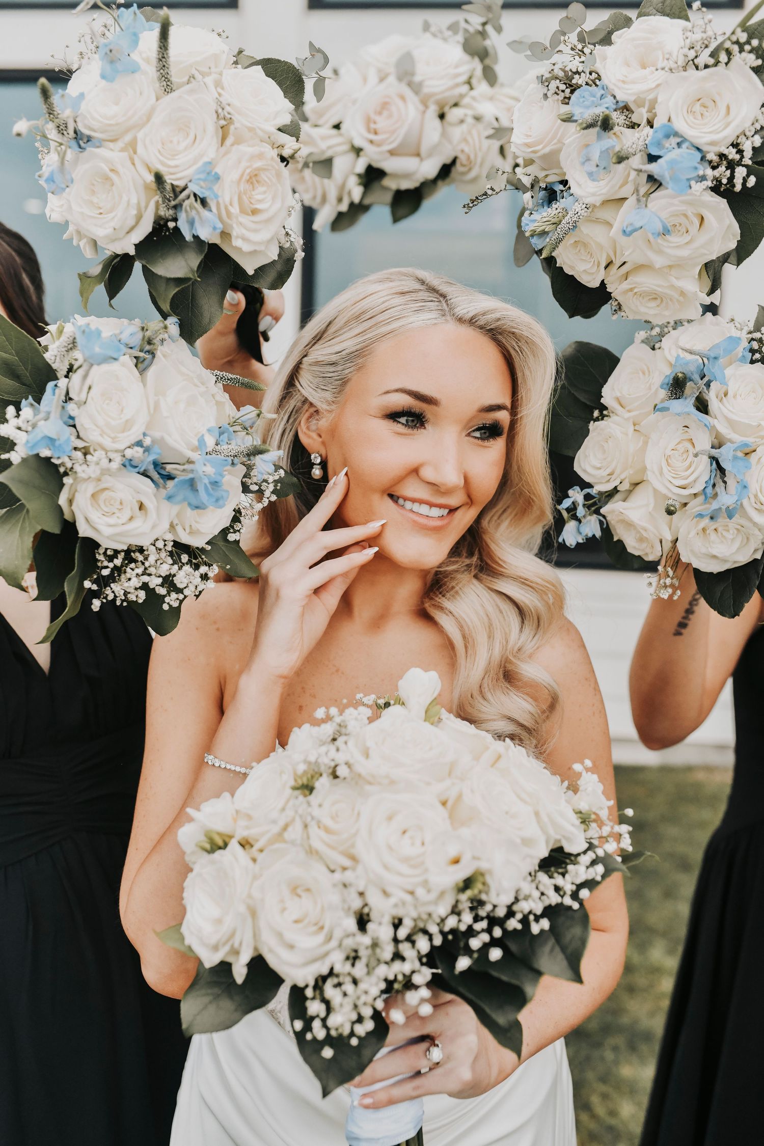 Bridesmaids laughing together during wedding day portraits