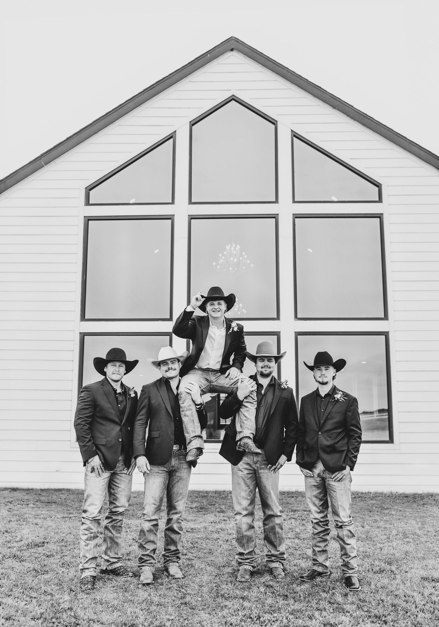 Groom and groomsmen celebrating before wedding ceremony