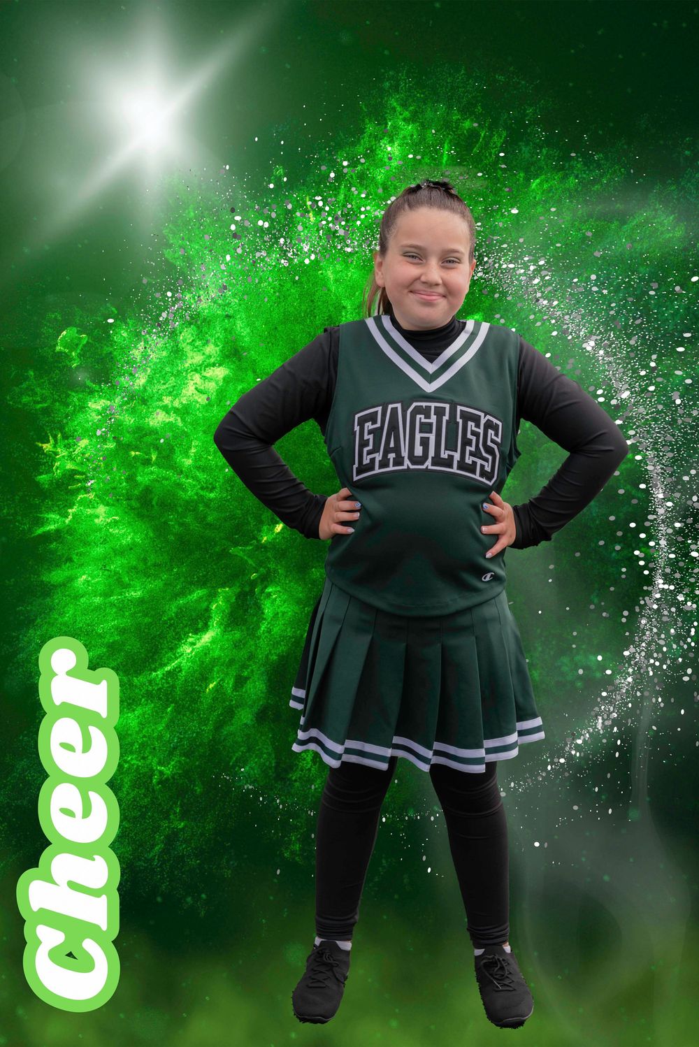 Preteen girl in Eagles cheer uniform smiles proudly against dynamic green smoke backdrop.