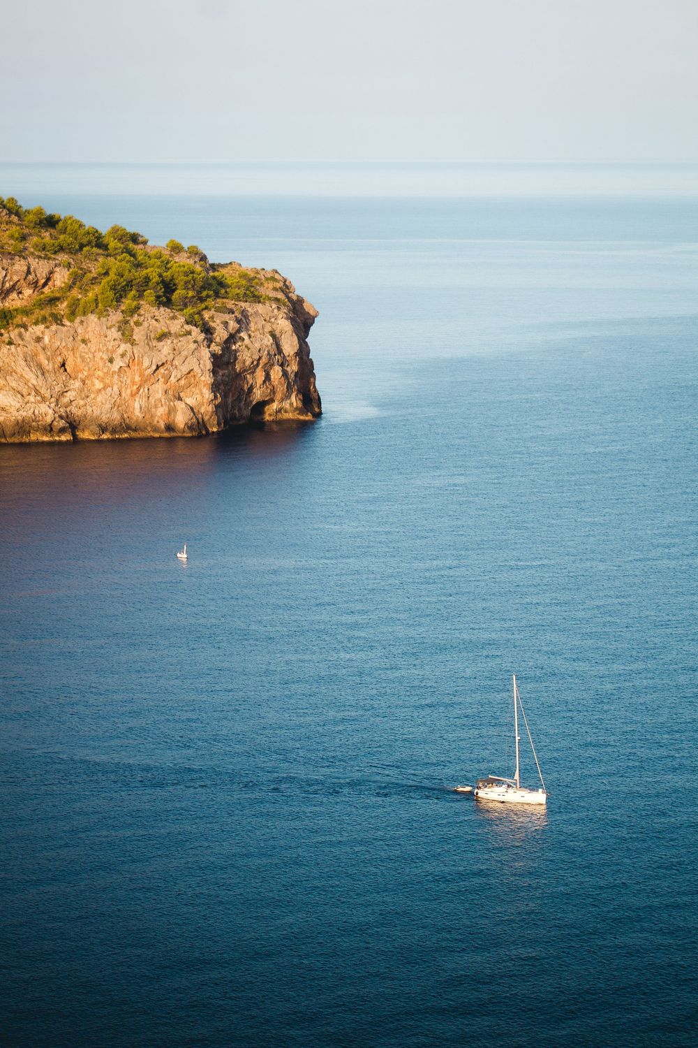 Mallorca, Spain boat sailing in the ocean, blue water, photography, lighthouse, island