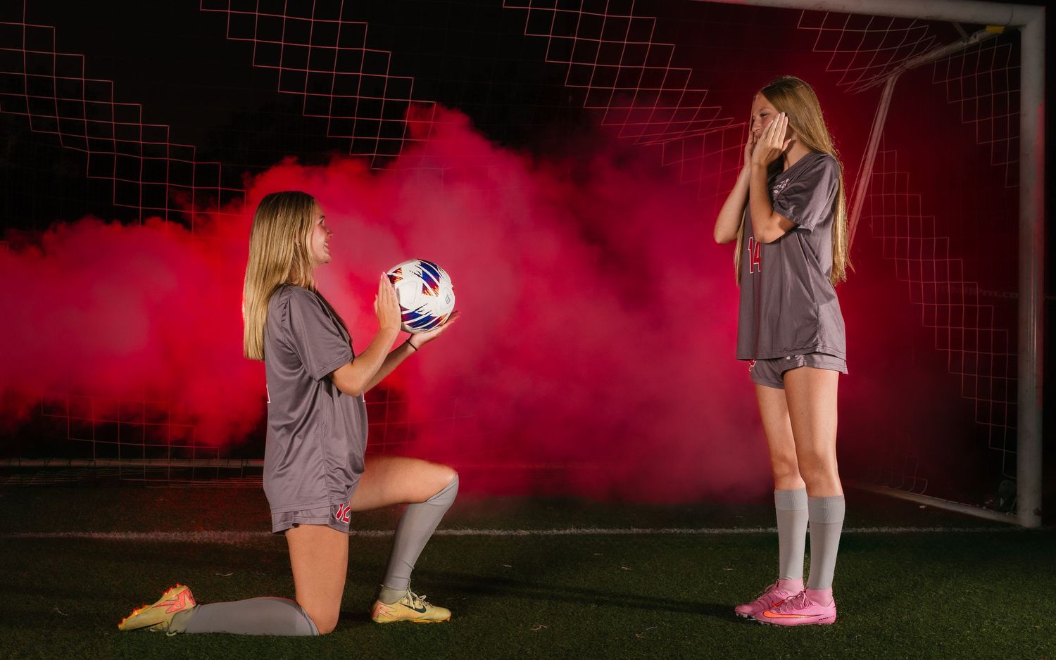 Parkland girls soccer player Media Day portrait with red smoke at goal, by Deanna Fox, SportsFox Photography, Hershey PA