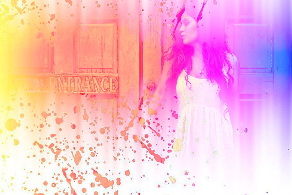 Artistic colorful paint splash effect photo of a woman in a white dress near an entrance door.