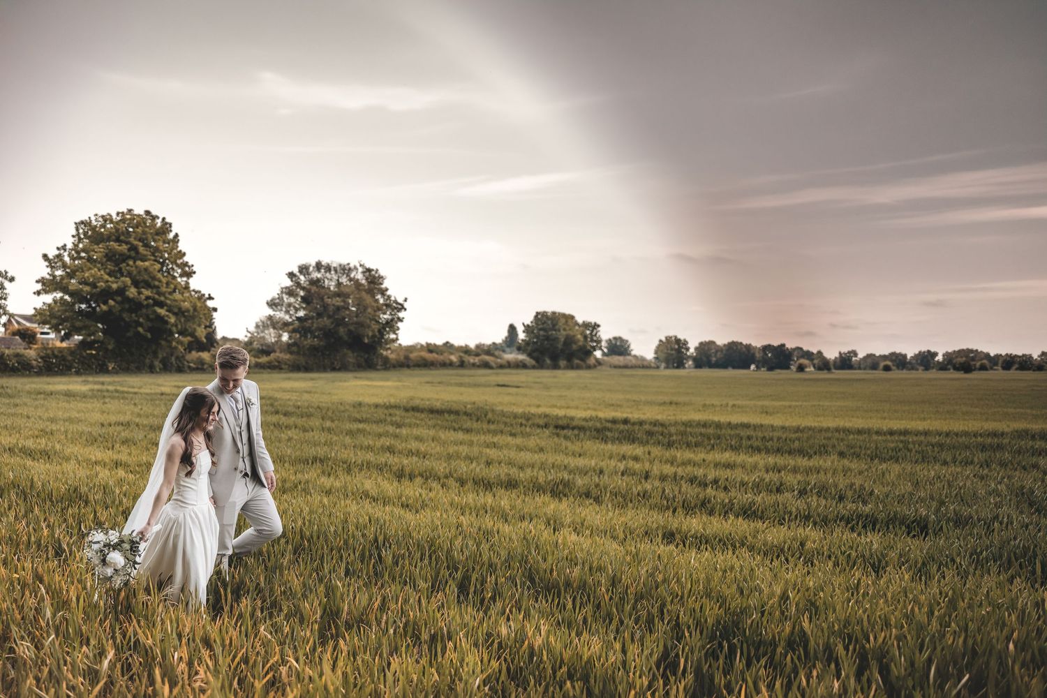 Couple walking together during relaxed wedding photography session.