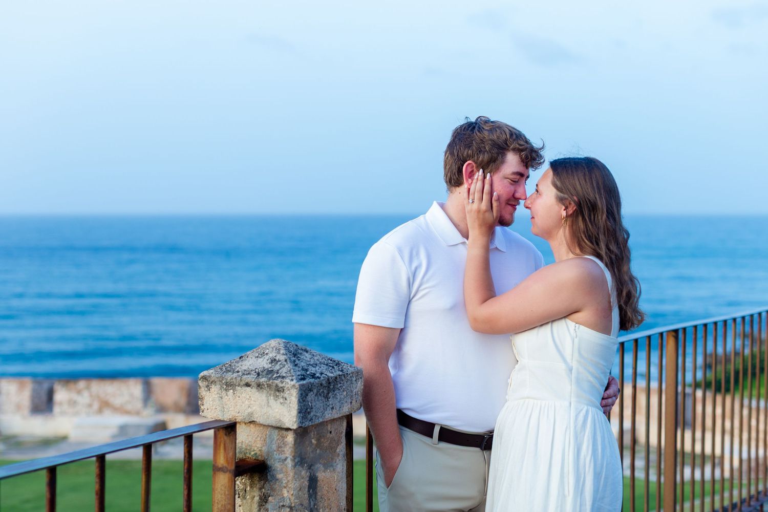 Couples portrait with the ocean in the background. Engagement photo session in Old San Juan, Puerto Rico.