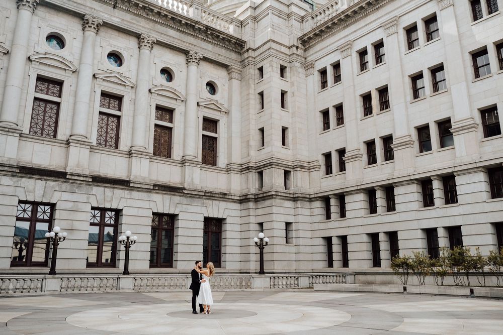 Couple embracing each other for their elopement photos at the PA State Capital Building in Harrisburg, PA