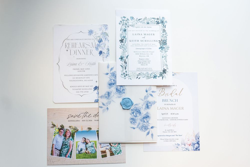 Blue floral wedding stationery suite including invitation, save the date, rehearsal dinner card, and bridal brunch invite.