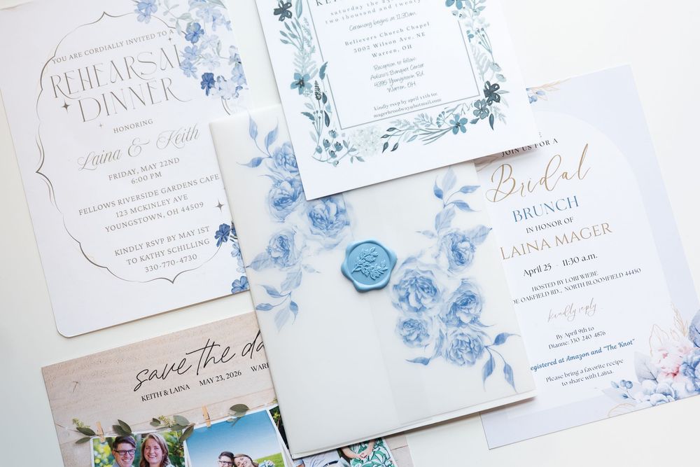 Elegant blue and white floral wedding stationery suite including invitations, save the date, and bridal brunch cards.