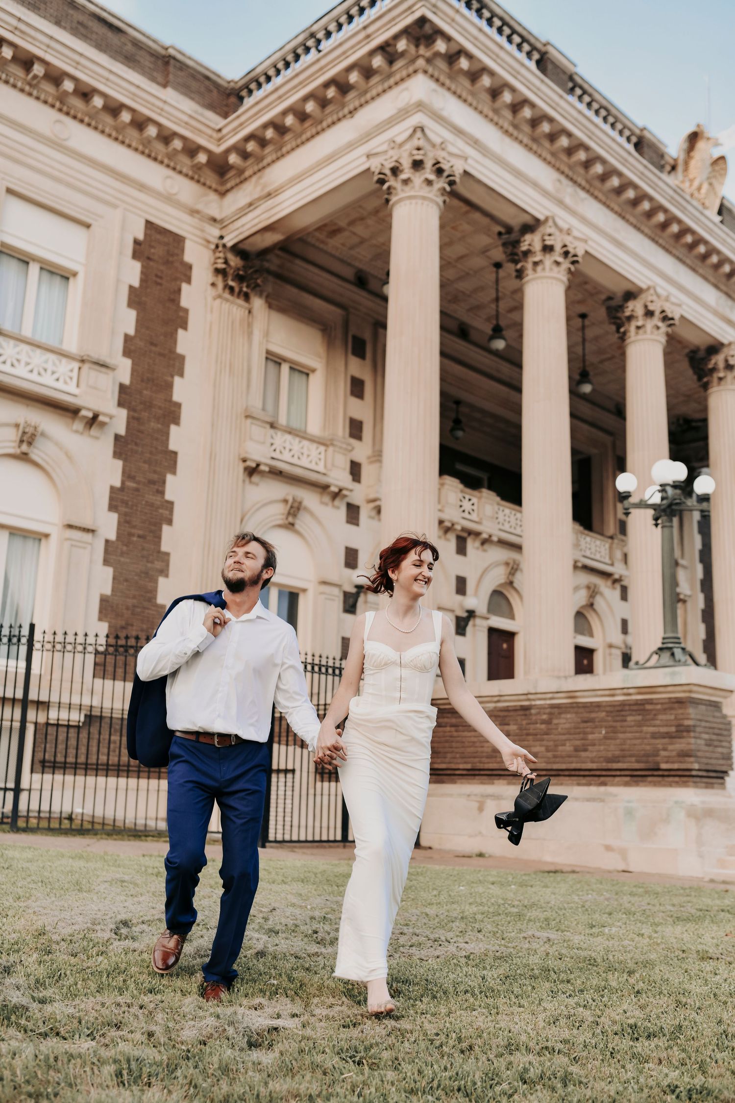 Couple walking through golden light in Dallas Historic District