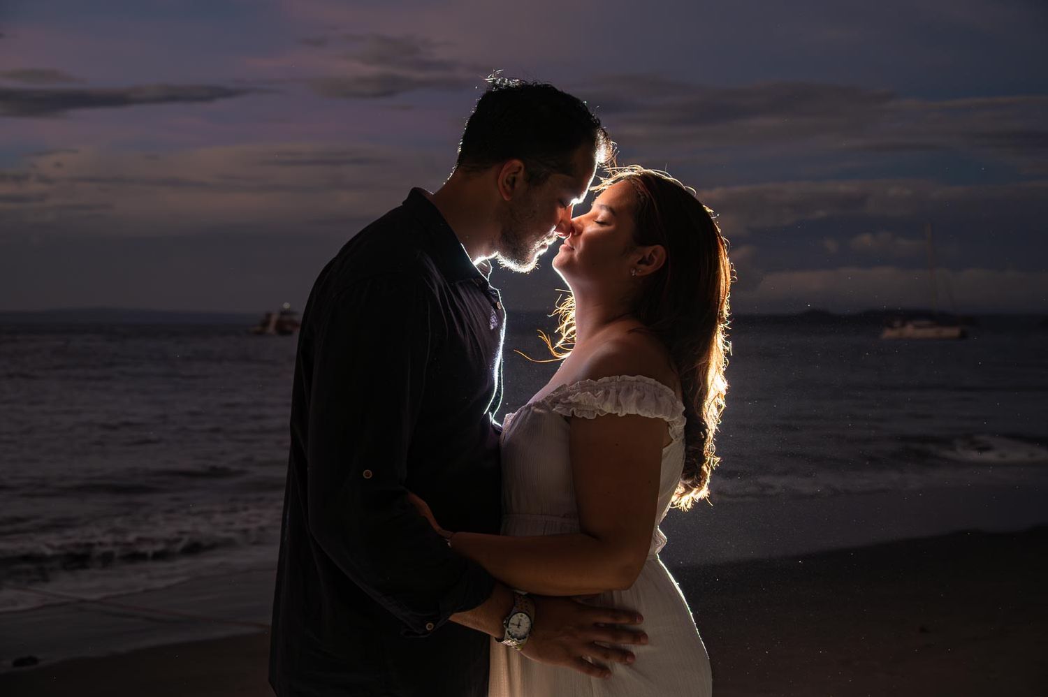 Couple celebrating proposal during sunset in Reserva Conchal, Costa Rica