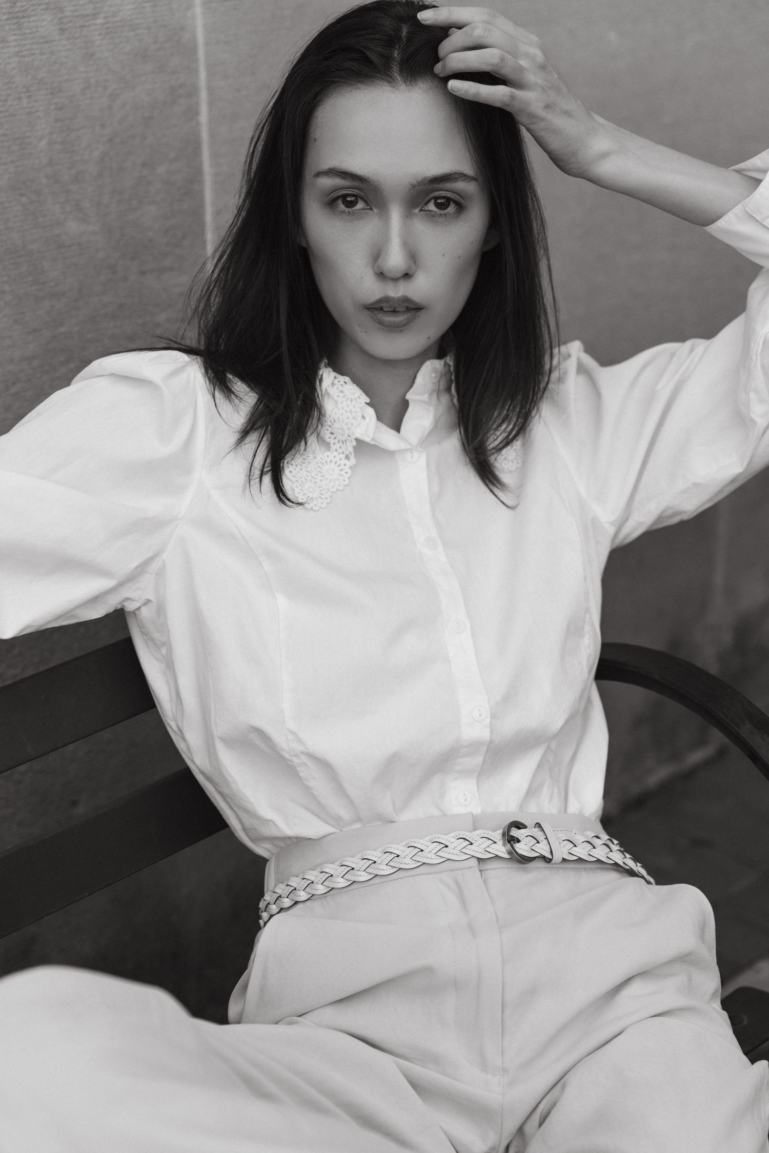 Editorial model sitting on European-style city bench, Historic Downtown Atlanta fashion photography