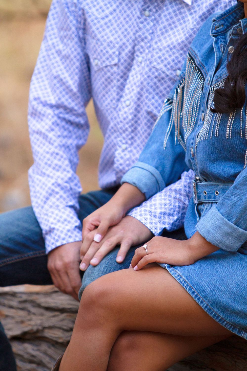 Accent photo of couple sitting next to one another during their engagement session