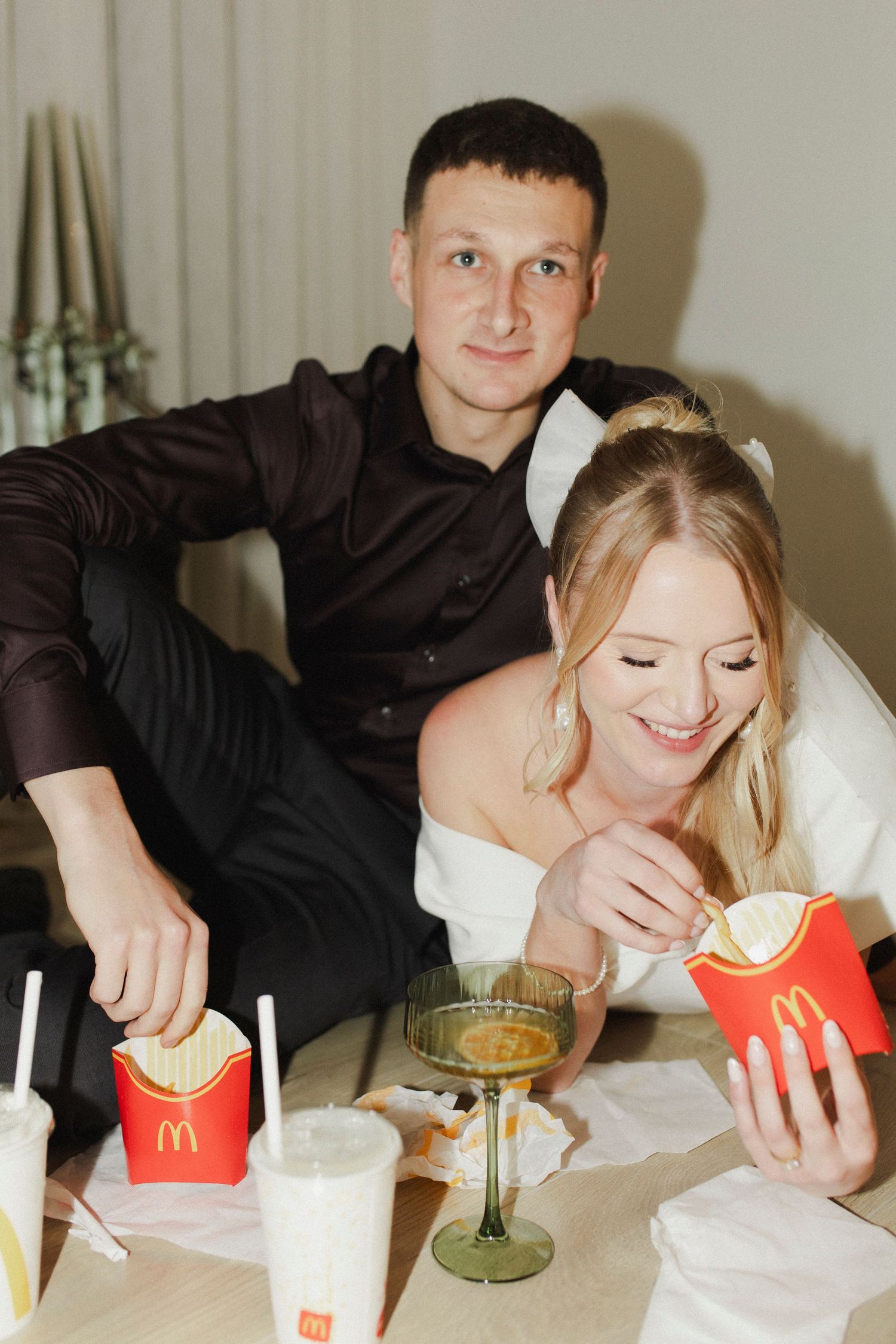 Couple eating takeaways on date night photoshoot in The Light Loft Hamilton