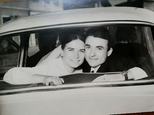 A black and white photo collage showing couples sitting in cars, capturing romantic moments from the 1950s era.