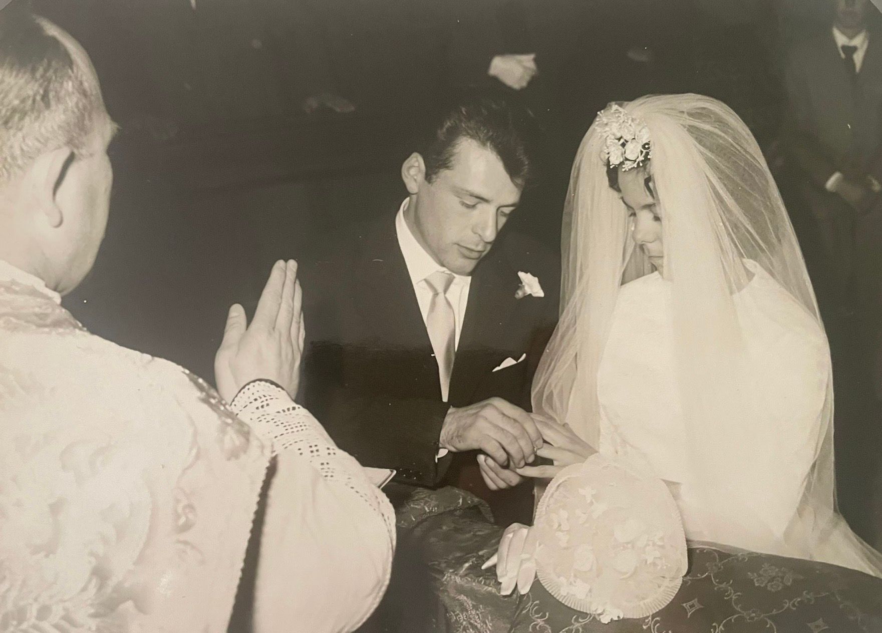 A black and white photo strip shows a bride and groom sharing intimate moments at their vintage wedding ceremony.