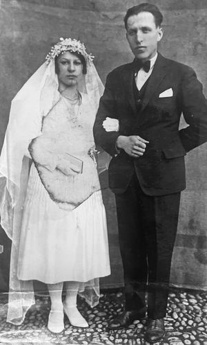 Vintage black and white photograph showing three wedding couples posing formally against a textured wall.