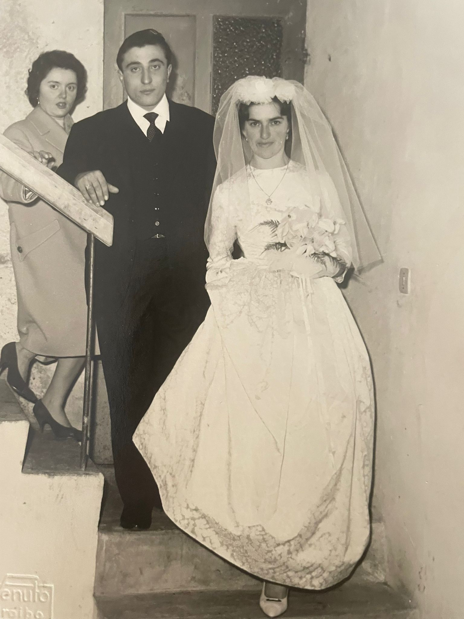 Collection of old monochrome photographs showing formal events with people in white dresses and formal attire.
