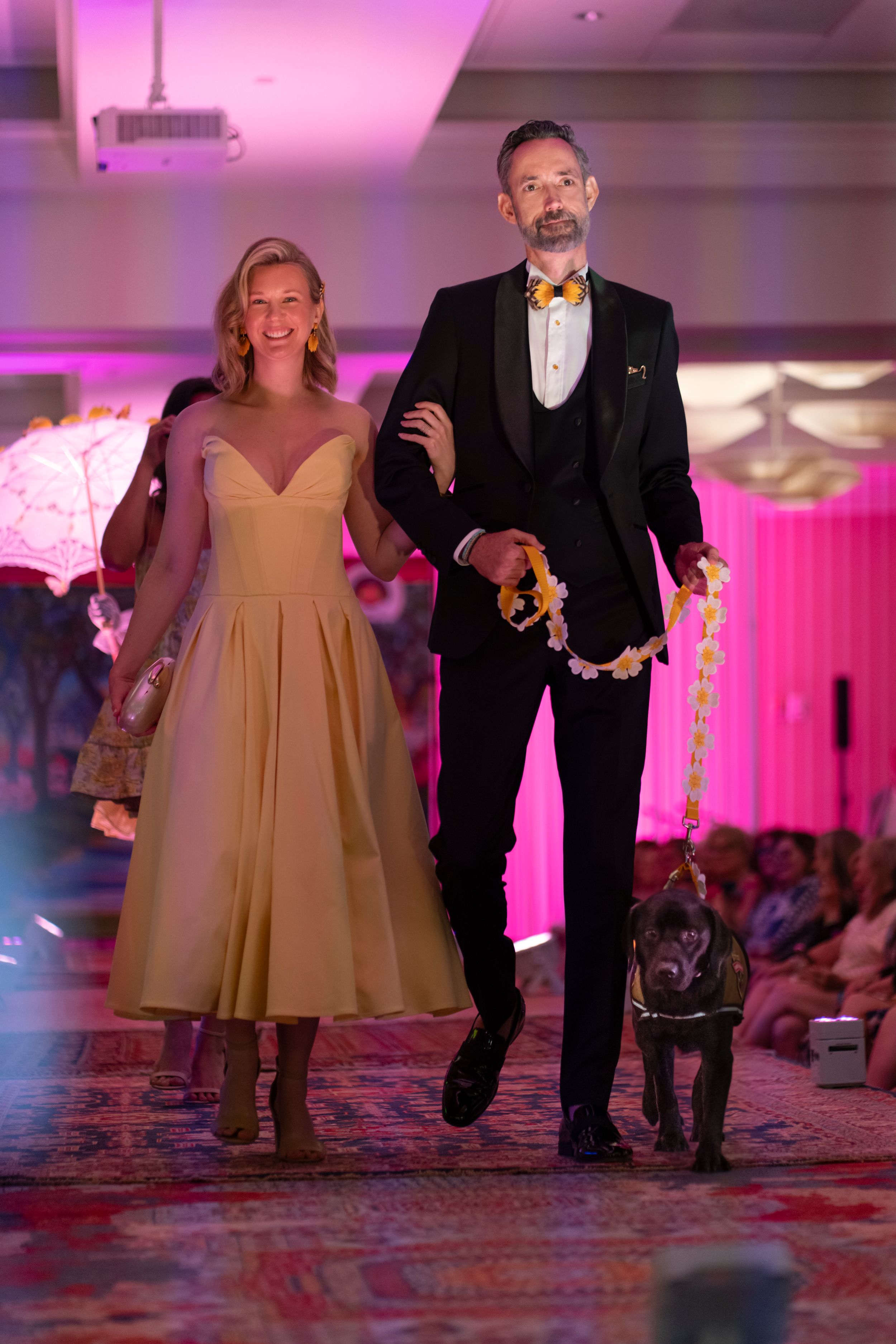 Rev Federal Credit Union team, mascot Dog Sailor, 2026 Azalea Festival Spring Fashion Show runway at Holiday Inn Resort Wrightsville Beach.