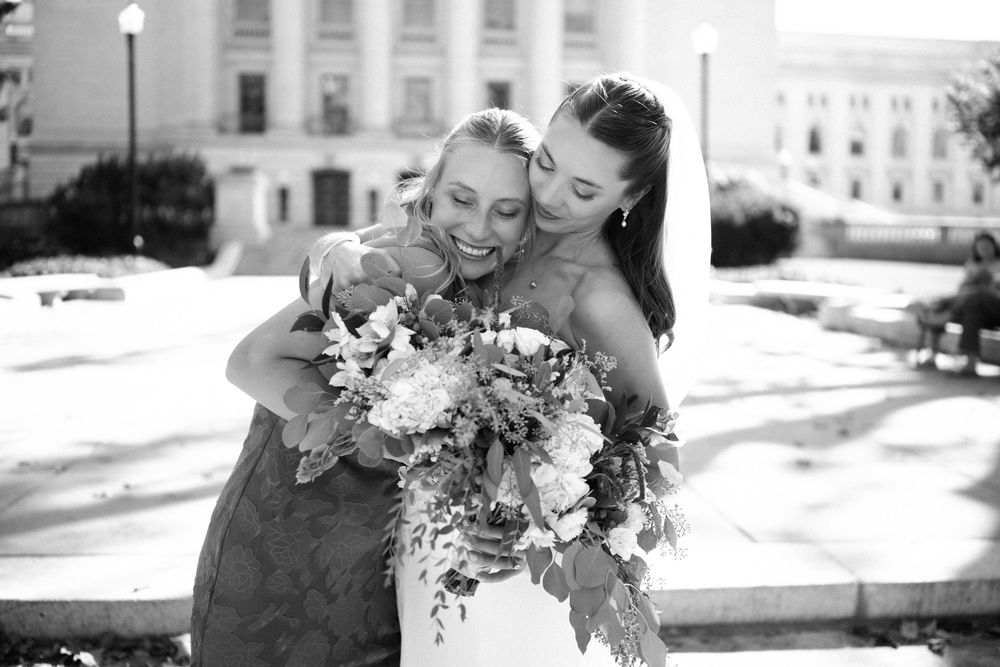 Happy couple shares intimate moments in black and white wedding photography series.