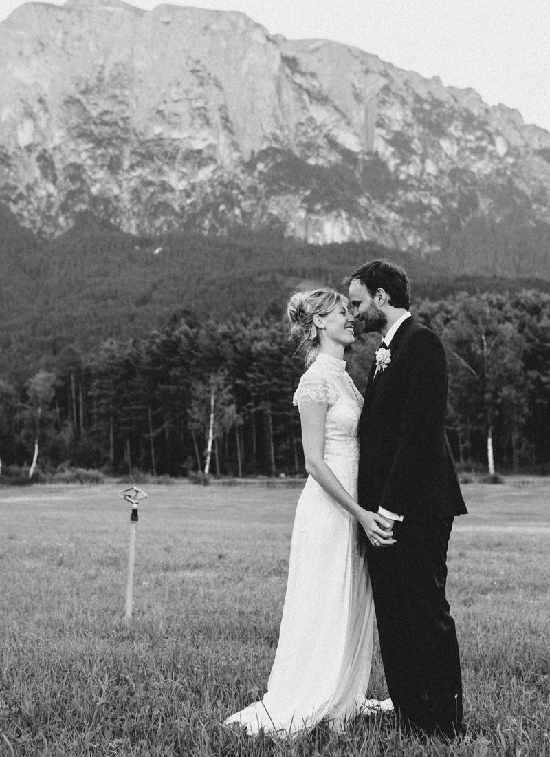 Bride and groom portrait with dramatic Dolomites mountain landscape